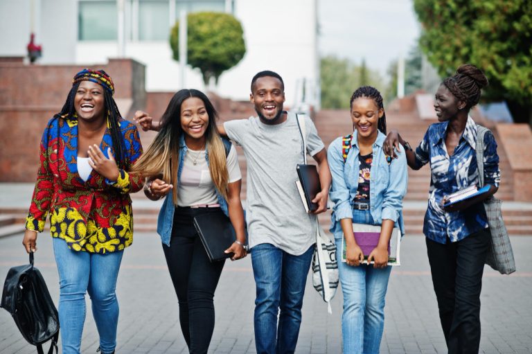 group-five-african-college-students-spending-time-together-campus-university-yard-black-afro-friends-studying-education-theme